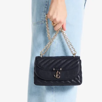 Curve Crossbody Small Marine – Gesteppte Umhängetasche aus Biker-Leder