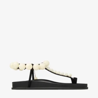 Miro Flache Sandalen aus schwarzem Wildleder mit Perlmuttkugeln